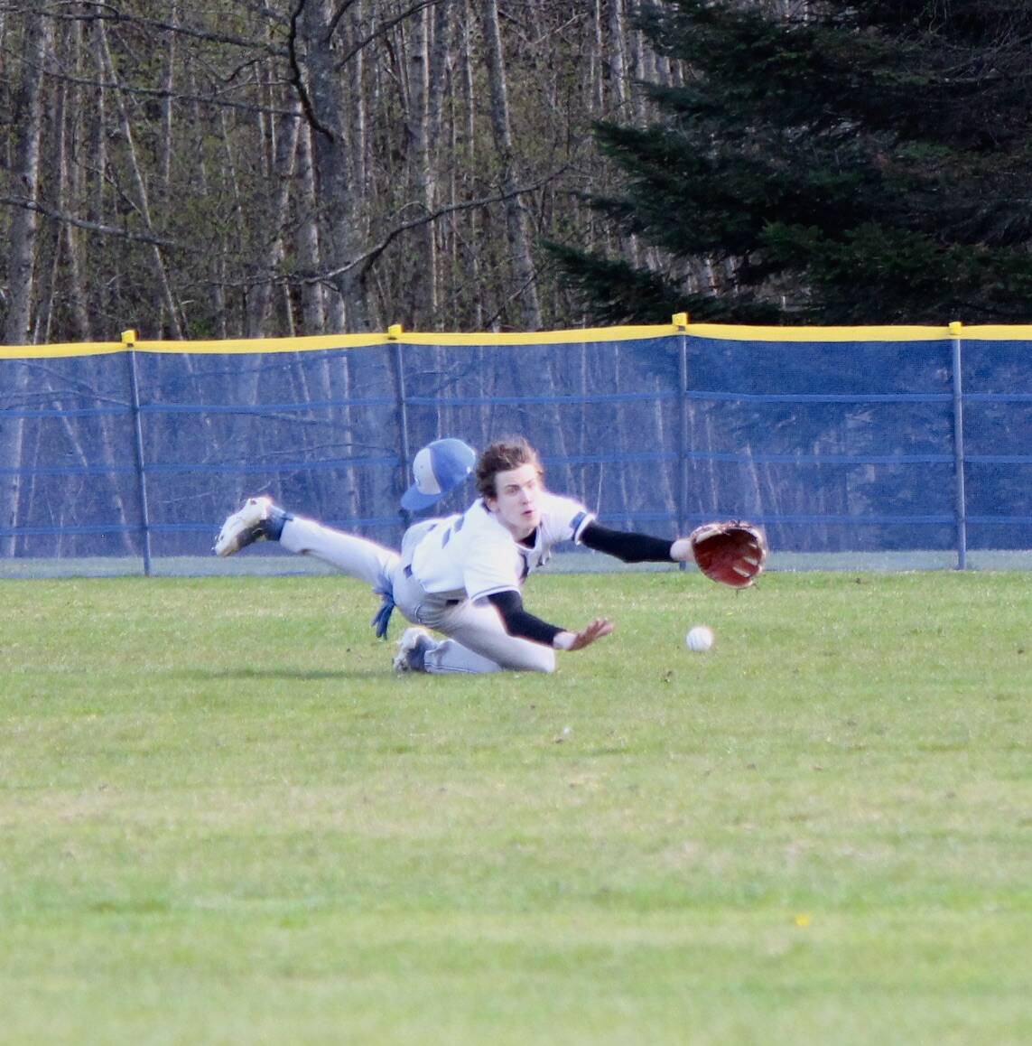Corey Wiscomb photo
Orcas outfielder Jefferson Freeman makes a diving grab for a bouncing line drive in the Coupeville game.