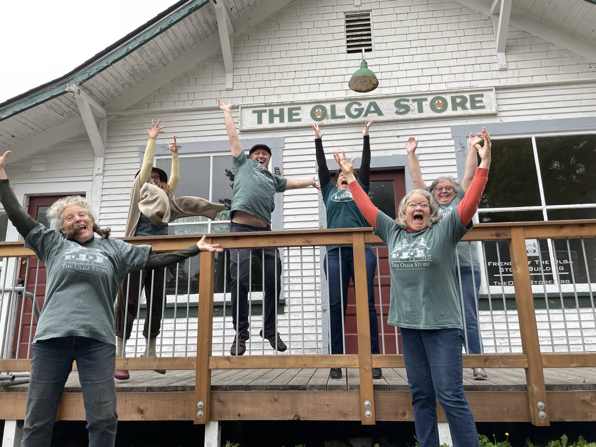 Contributed photo
Olga Store volunteers celebrate the store revival.