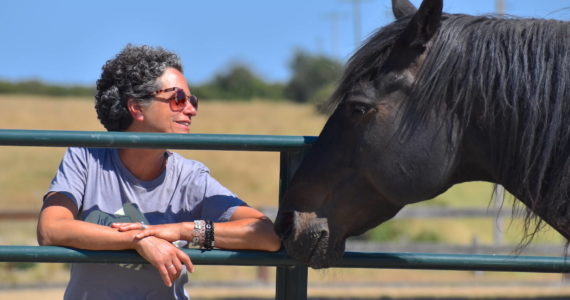 Kelley Balcomb-Bartok  Staff photo
Founder Julie Duke enjoys the company of horses, spending some quality time with Hans.