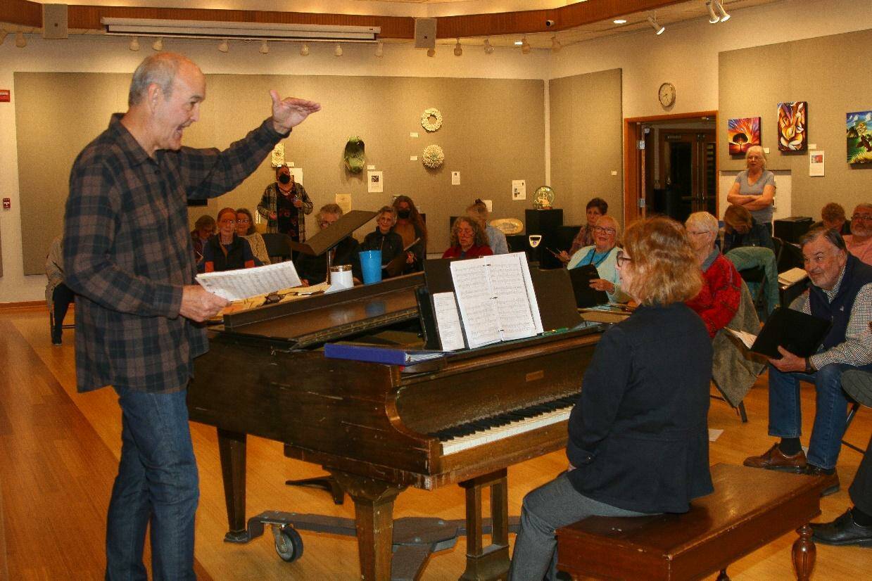 Contributed photo
Bruce Langford rehearses Orcas Choral Society members for “Celebrate!” with Terri Triplett at the piano.