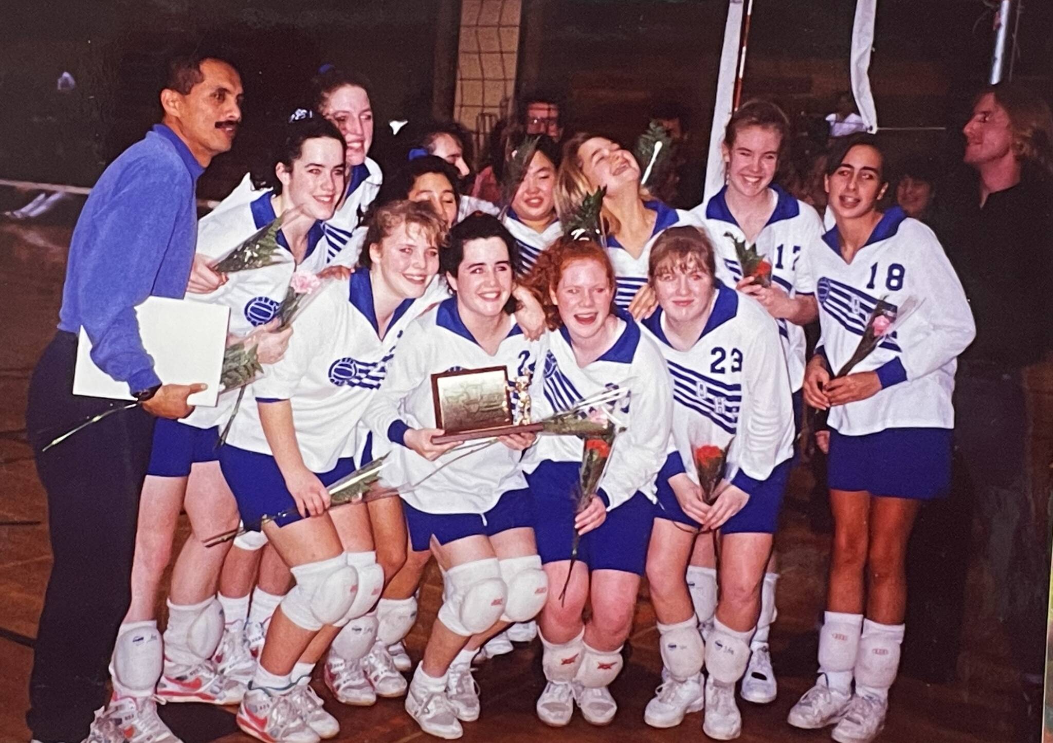 Gregg Sasan with the 1992 girls’ volleyball champs.