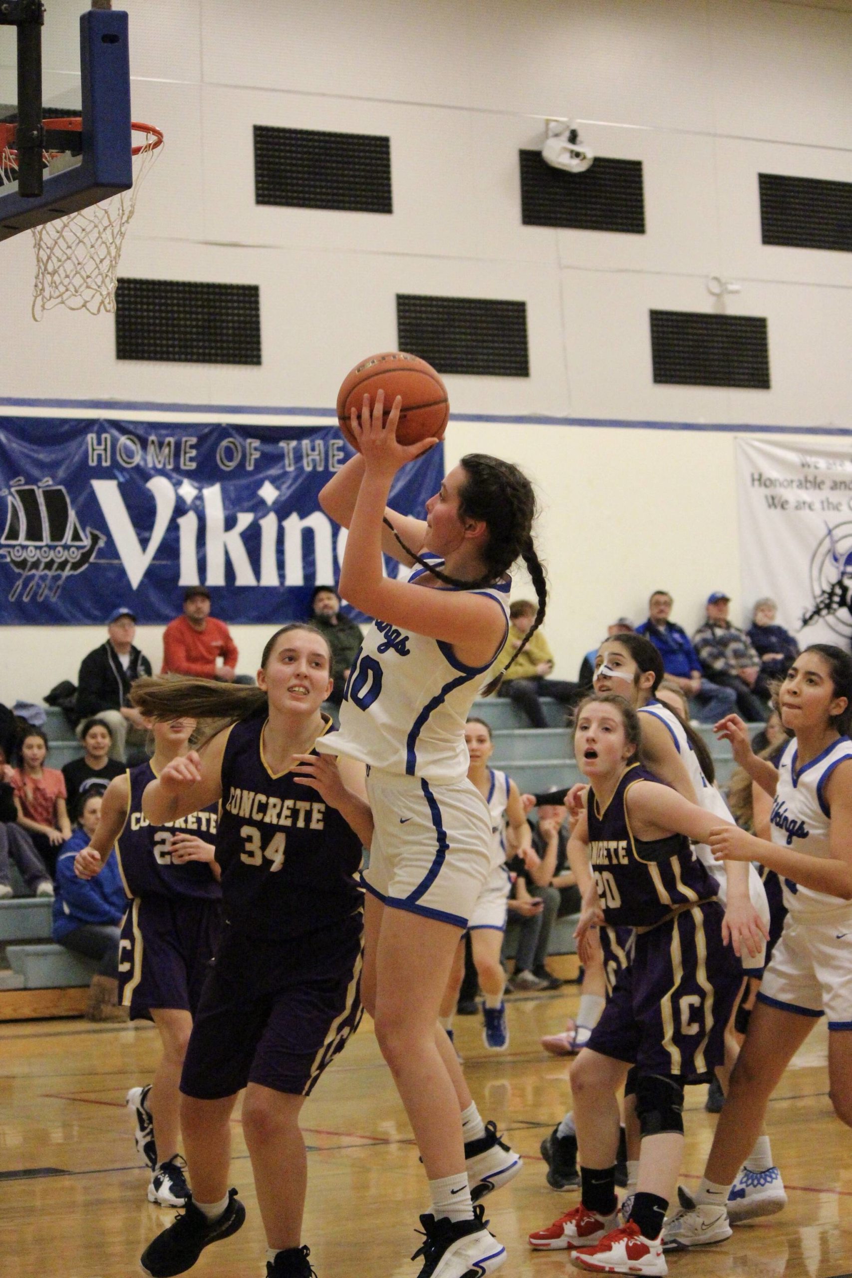 Corey Wiscomb photo.
Junior Sera Knapp hauls an offensive rebound before putting the ball back up and in for two.