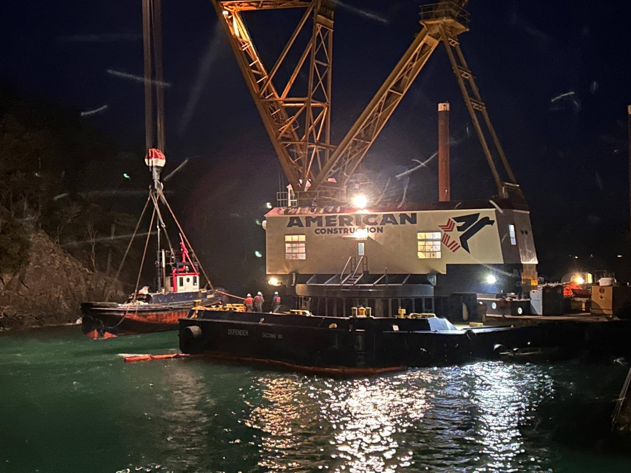 Contributed photo.
The partially submerged Tugboat Tulalip is successfully lifted from the waters near the Lopez ferry terminal Wednesday night.