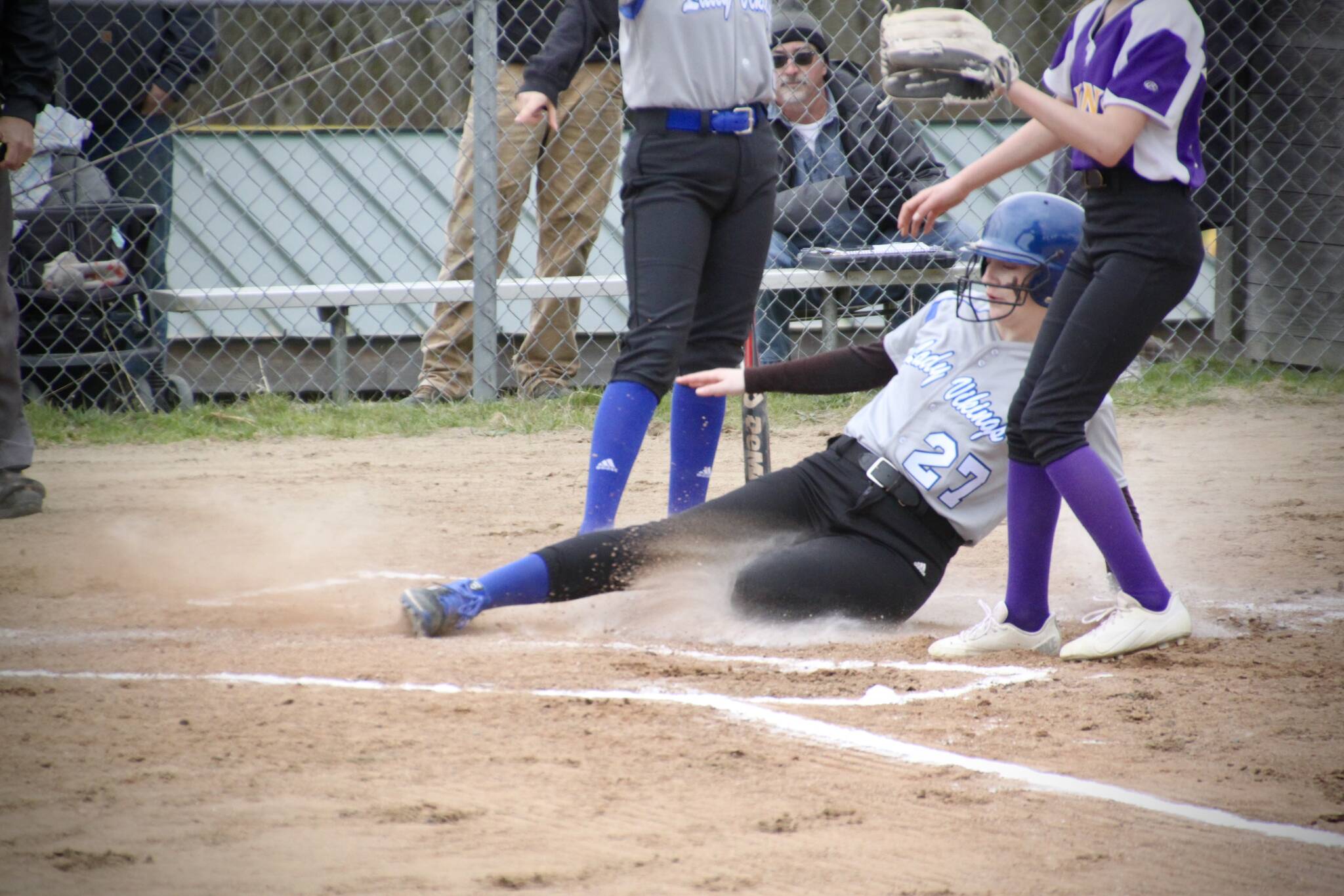 Corey Wiscomb photo.
Hannah Alexander in the midst of a dramatic slide into home plate against the Concrete Lions.