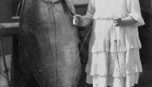 Contributed photo by the San Juan Island Historical Museum.
Grace (Dolly) Washburn c. 1917. The King salmon weighed 108 pounds, Grace weighed 65 lbs, she was 11 years old. The fish was caught in one of the fish traps off South Beach, San Juan Island.