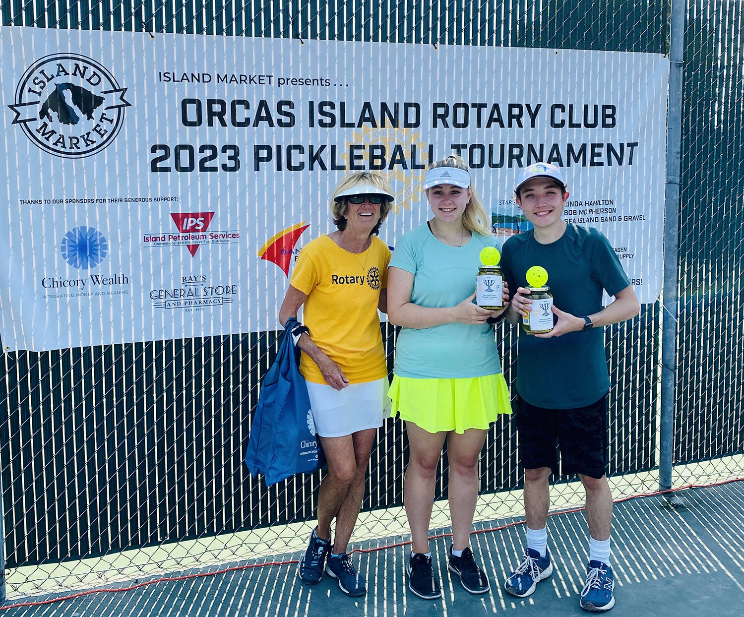 Tournament director Linda Hamilton with Group B Mixed Doubles second-place winners Monica Connell and Ethan Brazil.