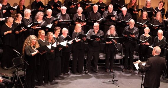 Bruce Langford directs Orcas Choral Society. (Photo by Douglas Ellis)