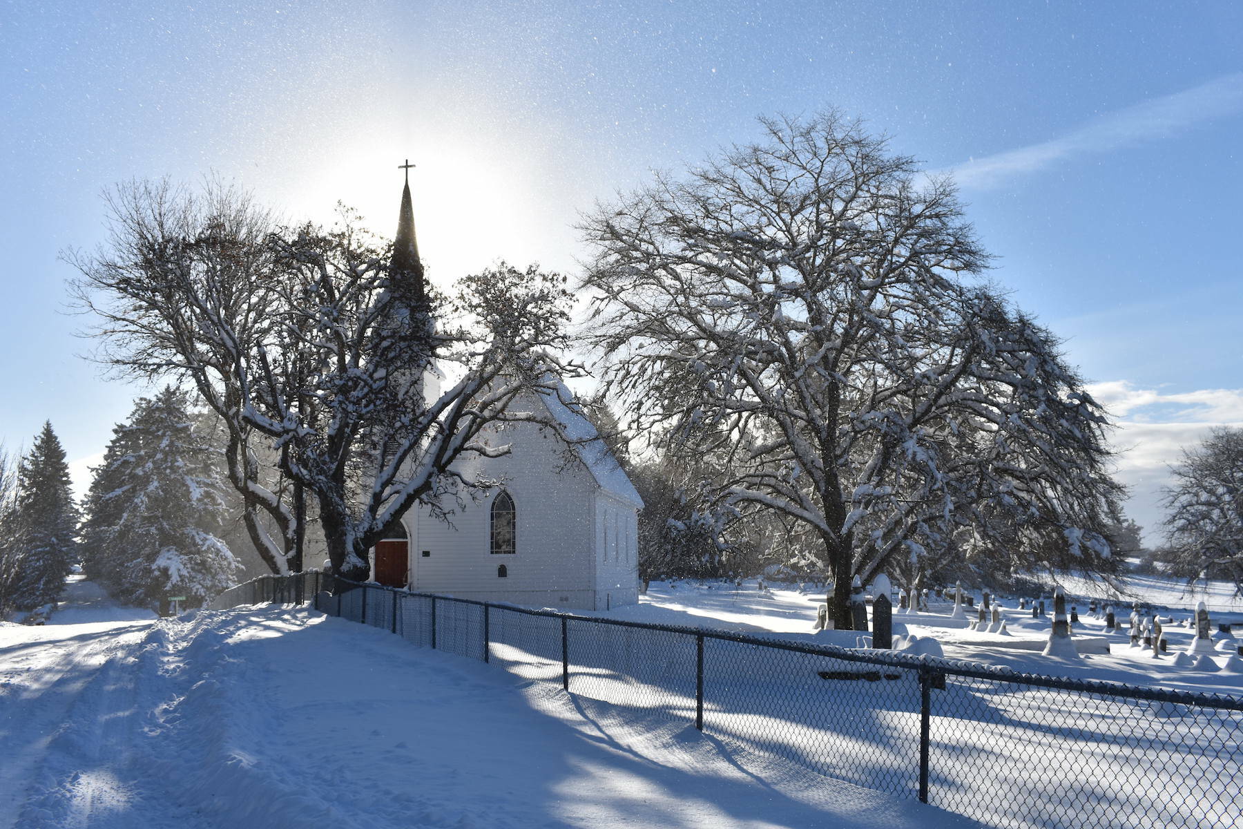 Kelley Balcomb-Bartok  Staff photo
Midday sun lights upon a snowy scene at the cemetery on San Juan island.