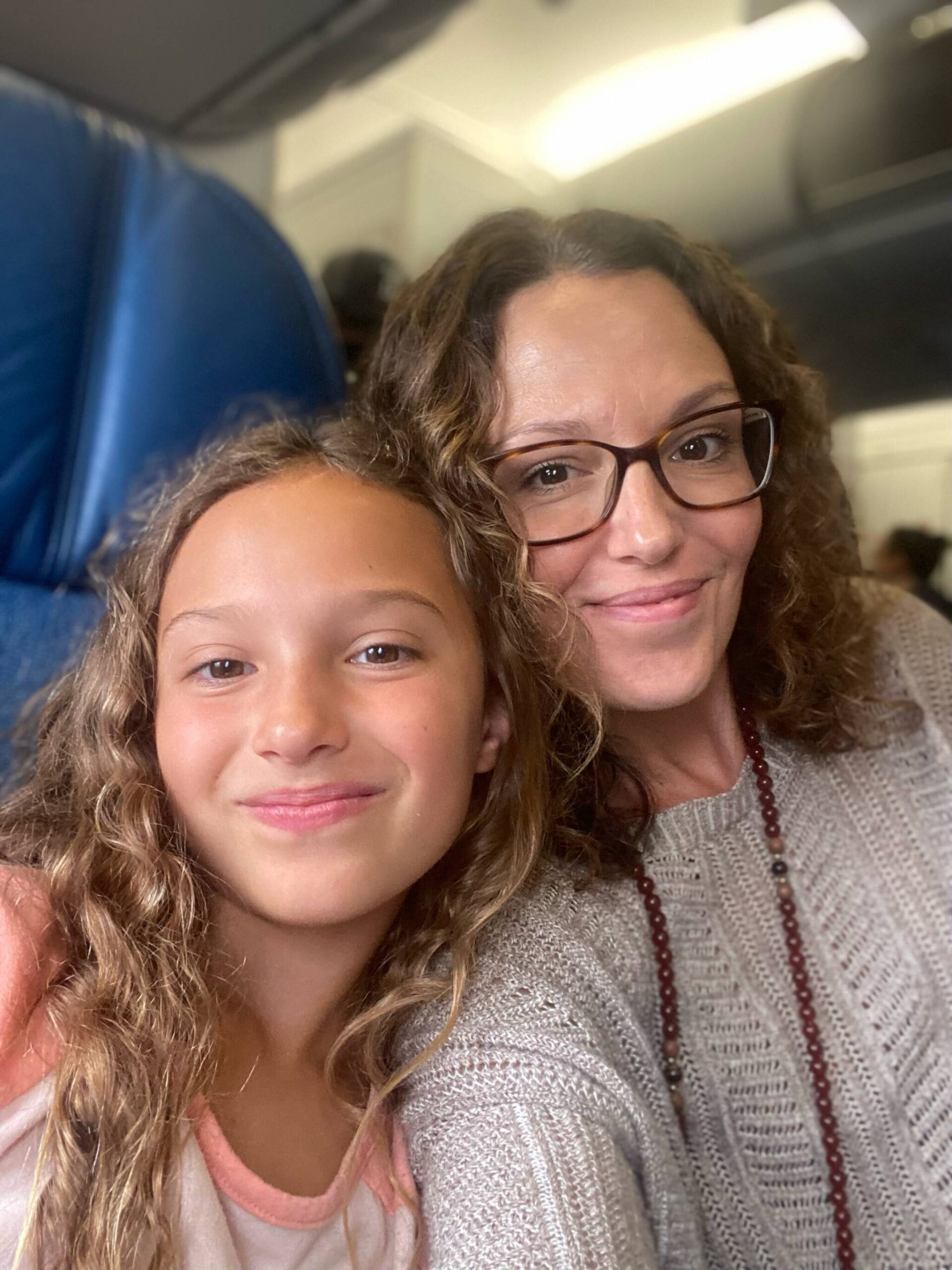 Eleanor and Monee on a flight to Oahu.