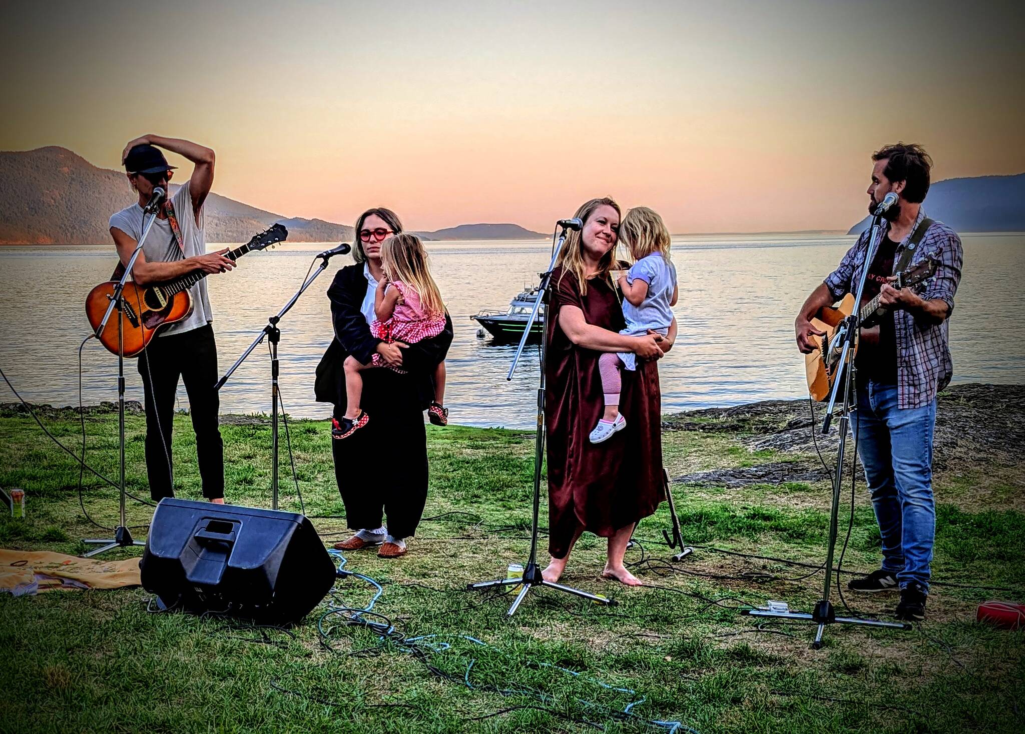 The Gervais Brothers, Mikey and Matty and their wives, Kaylee and Charity, performing on the Doe Bay waterfront.
