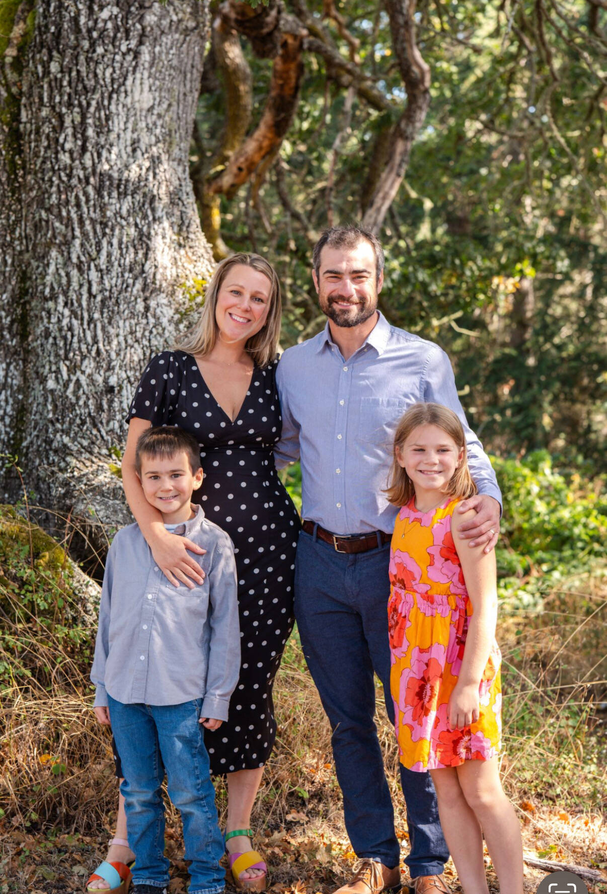 Sarah Carlson, a pediatric speech pathologist, says her familys Regence plan costs $2,000 a month with a $5,000 deductible per person. She is pictured here with her husband Mitch and their children.
