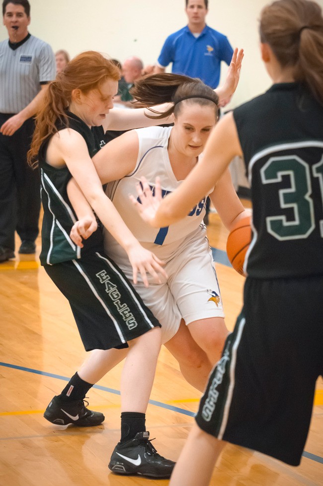 Alicia Susol (1) Drives through the Evergreen Lutheran Eagles’ defense leading to a baseline jumper and a trip to the foul line.