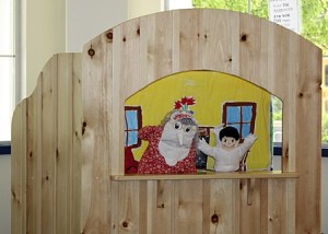 High school Spanish students performing a show in the new puppet theatre.