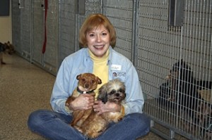 Marsha Waunch with two of the rescued dogs at the Orcas Shelter.