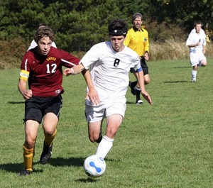 A Lopez player tries to steal the ball from a Viking.