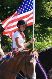Daria Stankevich rides in the parade.