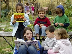Kids being read to at the day camp for children ages three to six.