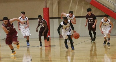 The Orcas Saints men’s basketball team.