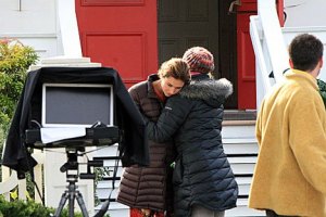 A model for a Norm Thompson catalogue shoot gets a warming hug from another member of the crew.