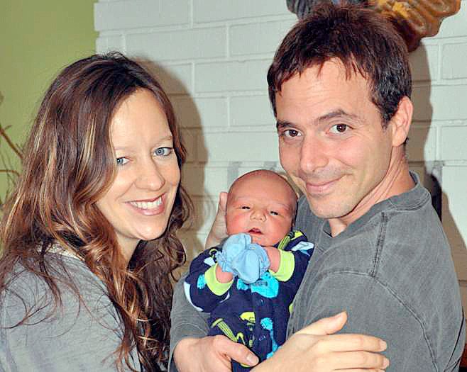 Kristi and Jacob Angel with their new son