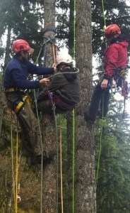 Phoenix Welty (far left) rescues Keegan Cookston. Jeff Wakefield with Ascension Group NW instructing (far right) looks on.