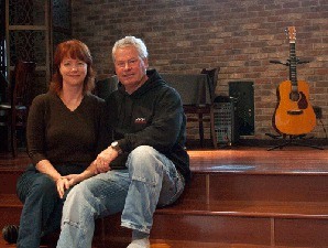April and Clyde Duke on the stage at Random Howse on North Beach Road in Eastsound.