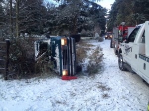 The flipped vehicle on Enchanted Forest Road.
