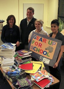 Dyan Holmes and Marelsy Vallejano (middle and far right) of Islanders Bank presented Orcas School K-6 principal Kyle Freeman and Julie Pinardi (far left) of Readiness to Learn with boxes of notebooks