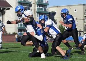 Jacob Hansen (34) working hard for a Viking first down.