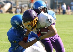 Two Vikings take down a Wolverine during the 2011 Island Cup. Orcas took home the trophy for the second year in a row.