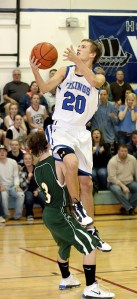 Taylor Diepenbrock (20) at the end of a fast break with a layup.