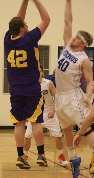 Viking Jake Zier jumps up to block a shot by a Concrete player.