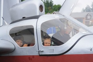 Dr. Shinstrom takes a planeful of small passengers aloft in his craft as part of Young Eagles Day at the Eastsound Airport.