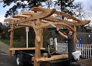 Zacharya Leck puts the finishing touches on his sculpture before its delivery to an Orcas garden.