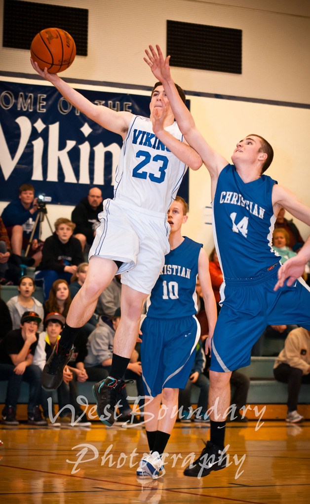 Devon Stanzione (23) finishing up a fast break with a flourish.