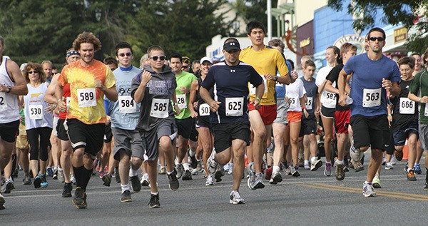 Runners taking off at the start line for the Loop Run