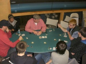 Players in Middle and high school gathered around  poker tables for the Funhouse-Common’s Inagural Texas Hold ‘em Poker tournament