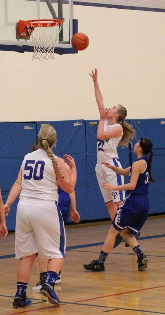Bethany Hansen goes for the shot with Jess Nichols looking on.