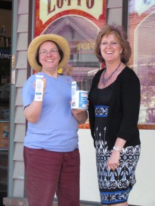 Carol Vincent-Hall and Candace Bodenhamer placing collection cans.