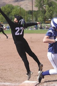 Alenna Garcia reaches high to catch the ball.