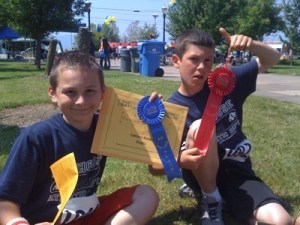 Jordan Randolf and Miles Harlow show off their awards.
