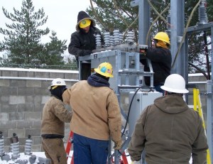 Orcas line crew replaces breaker in the Eastsound Substation. Pictured (l-r): Roger Sandwith