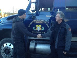 Firefighter and EMT George Schermerhorn shakes hands with Division Chief Patrick Shepler after responding to the call.