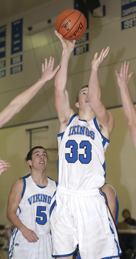 Nick VanMaren (33) Up for a short jumper and another Orcas basket.