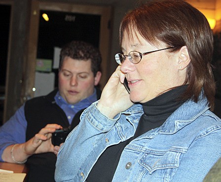 Principal Kyle Freeman and school board member Janet Brownell anxiously checking the results of Tuesday's election.