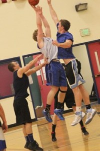 Alumni Aubrey Schermerhorn (left) and Mikail Van Maren (right) go up against Viking Jake Zier.