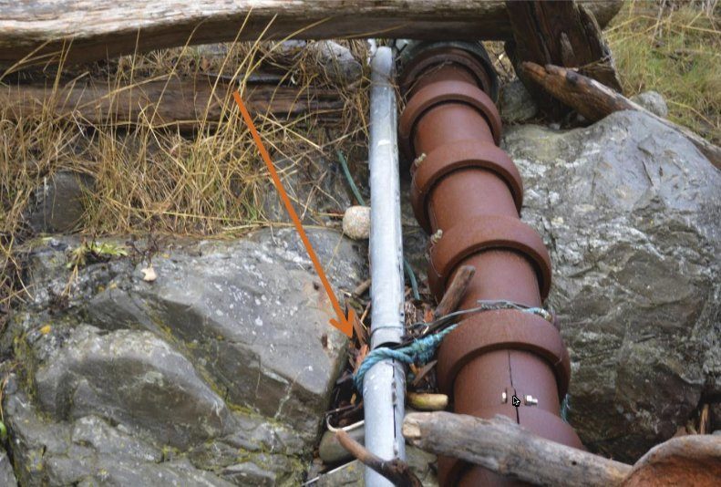 Contributed photo/Public records request                                CenturyLink&rsquo;s fiber cable is tied to OPALCO&rsquo;s power cable with rope and wire.