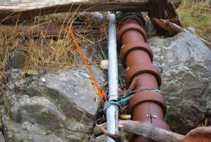 Contributed photo/Public records request CenturyLink&rsquo;s fiber cable is connected to OPALCO&rsquo;s power cable with rope and wire near OPALCO&rsquo;s Pear Point substation.