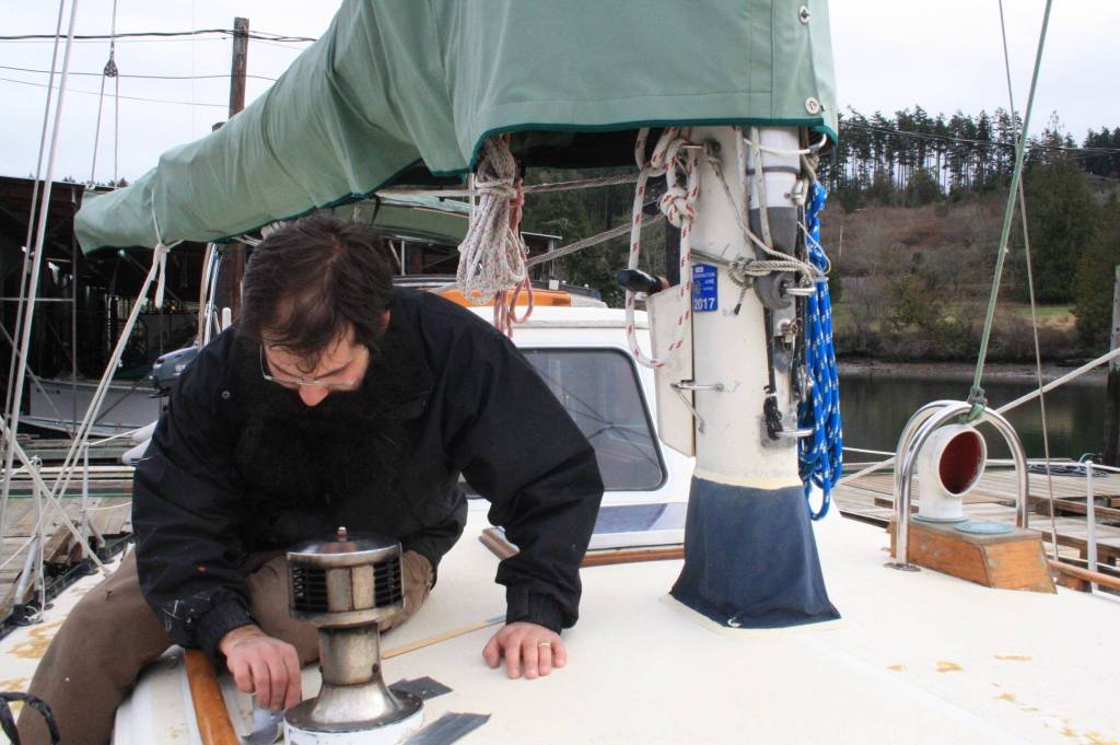 Staff photo/Hayley Day                                Nate Hertel fixes a boat deck at Albert Jensen and Sons Boat Yard and Marina on San JuanIsland. Hertel learned boat repair while in the U.S. Coast Guard.