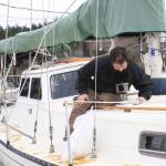 Staff photo/Hayley Day                                Nate Hertel repairs a boat deck at Albert Jensen and Sons Boat Yard and Marina on San JuanIsland.